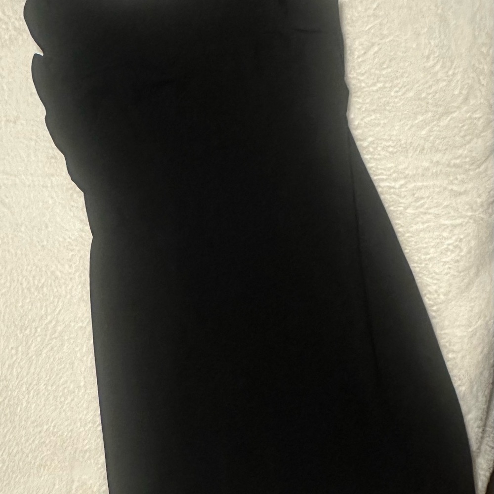 Sleeveless dress with ruffle detail.